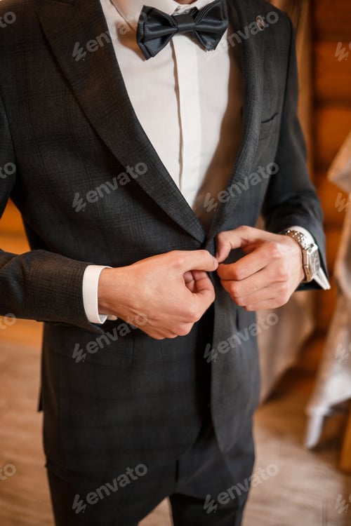 Preview: Man Fastening Buttons of Elegant Grey Suit