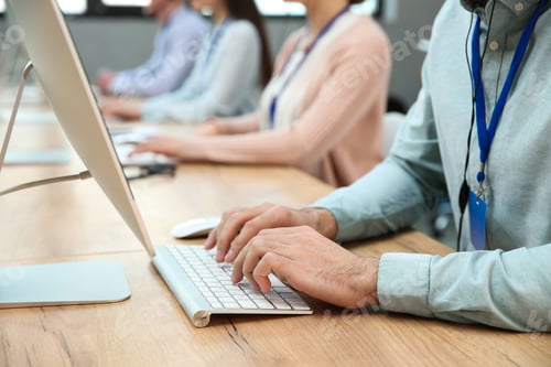 Preview: Technical support operator working at table in modern office, closeup