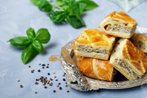 Preview: puff pastry pie with meat on a wooden board