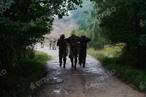 Preview: A group of elite soldiers leads captives through a military camp, showcasing a tense atmosphere of
