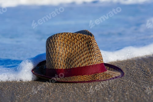 Preview: Closeup shot of a hat on a foamy wave