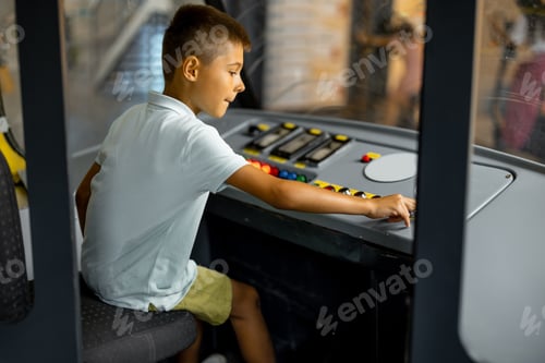 Preview: Little boy drives an old tram simulator in a science museum