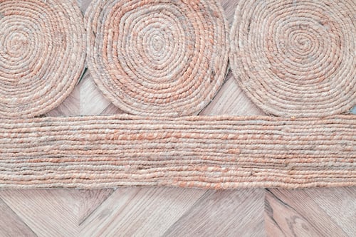 Preview: Beige rug carpet on wooden floor top view