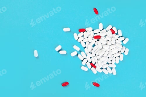 Preview: Heap Of Pills On Blue Background. Top View With Copy Space