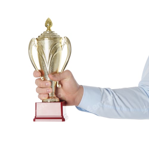 Preview: Man with golden trophy cup on white background, closeup
