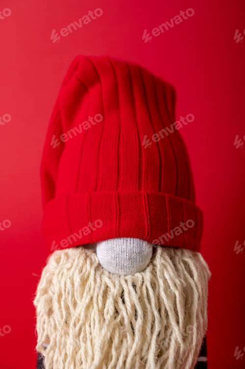 Preview: Handmade Christmas gnome on red background