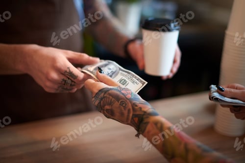 Preview: Customer paying for her coffee with cash