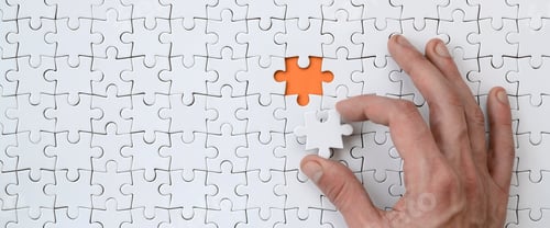 Preview: The texture of a white jigsaw puzzle in the assembled state with one missing element that the male
