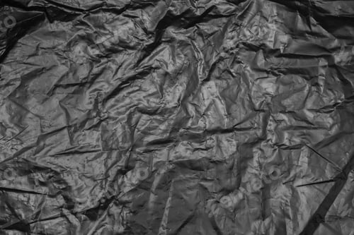 Preview: Wrinkled Black Material Background with Textured Surface