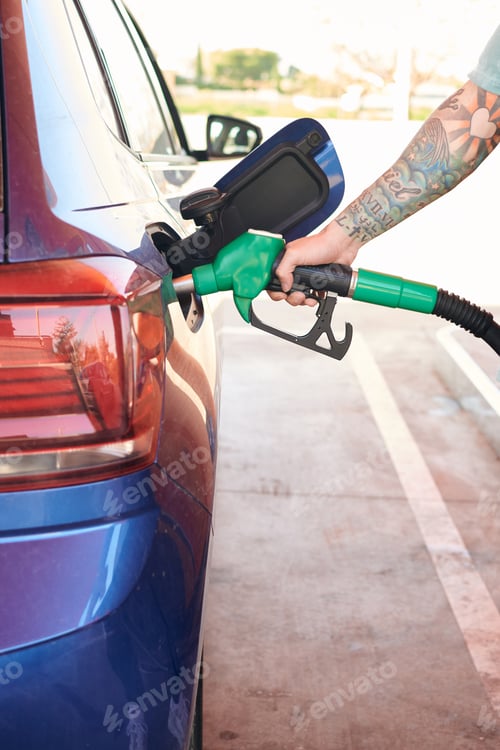 Preview: Close-up of a man pumping gasoline