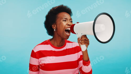 Preview: Black woman, bullhorn and voice for protest in studio with opinion, sound and anger by blue backgro