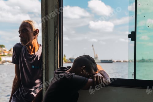 Preview: LA HABANA, CUBA - NOVEMBER, 6 , 2018: Frustrated boy with head on hands near opened window