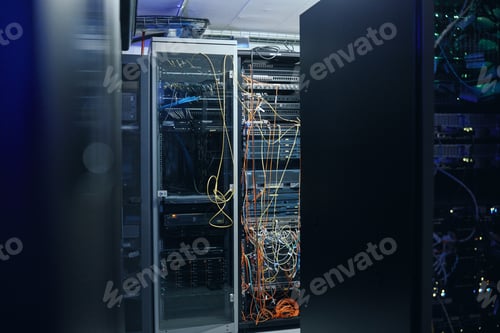 Preview: A neat and tidy server room. Cropped shot of an empty and large server room.