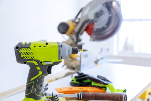 Preview: Drill, Miter Saw, and Tool on White Surface