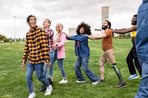 Preview: Joyful Diverse Friends Holding Hands and Running in a Park
