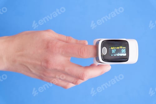 Preview: Pulse oximeter on a finger on a blue background