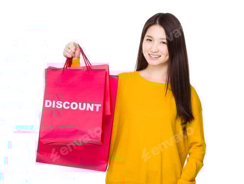 Preview: Woman hold with red shopping bag showing a word discount