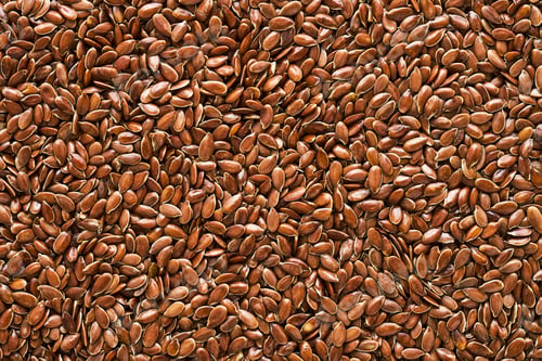 Preview: Linseed or flaxseed background, brown flax seeds. Flat lay, copy space