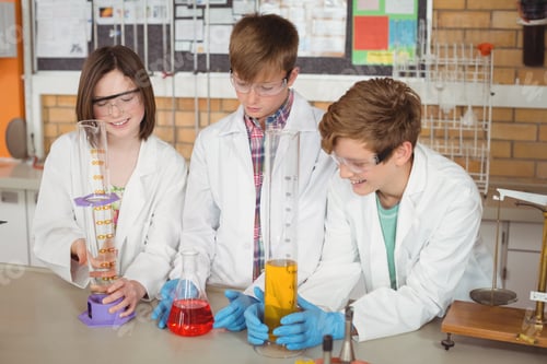 Preview: Schoolkids doing a chemical experiment in laboratory