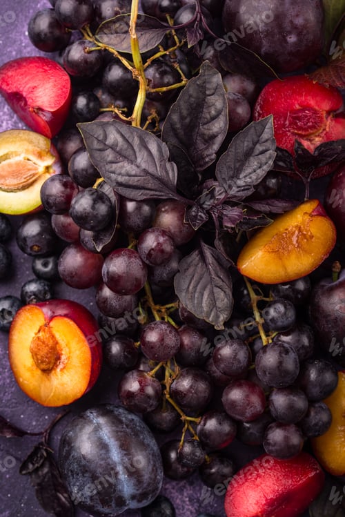 Preview: Assortment of purple fruit plum, grape, blueberry and basil