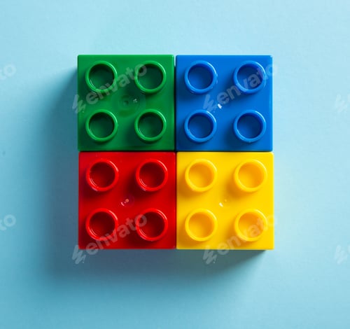 Preview: Color plastic building blocks on blue background