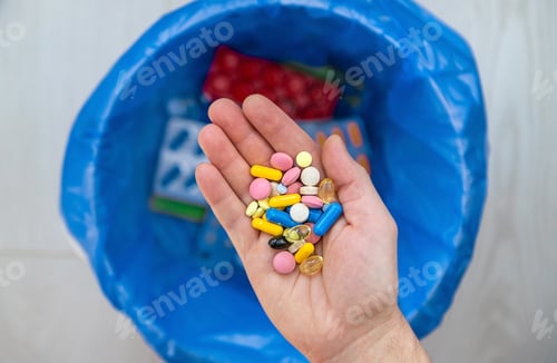 Preview: Throw tablets in the trash. Selective focus.