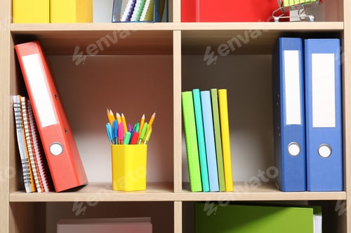 Preview: Colorful binder office folders and other stationery on shelving unit