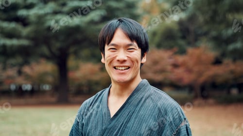 Preview: Martial arts, portrait and smile of Japanese man in forest for exercise, fitness or training. Cultu