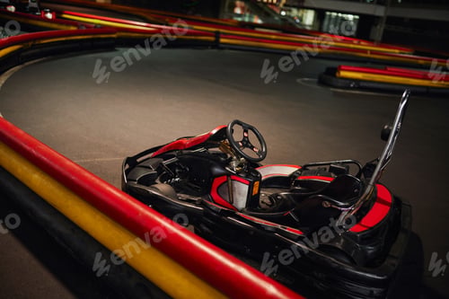 Preview: go kart, car for racing or red racing, inside of indoor kart circuit, motor race vehicle