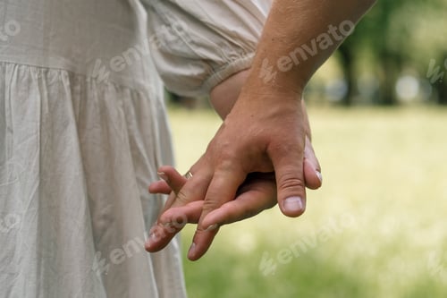 Preview: hands of couple in love close-up couple holding hands concept of support care love happy family