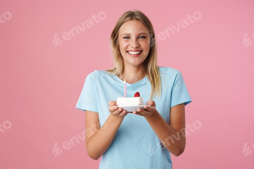 Preview: Happy beautiful girl smiling while posing with birthday cake