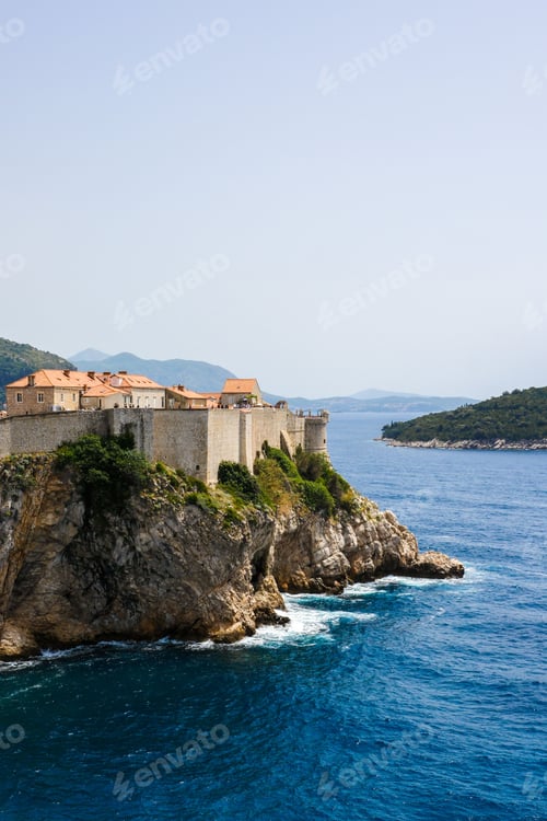 Preview: view of the historic Dubrovnik city walls on rocky cliff overlooking the Adriatic Sea in Croatia