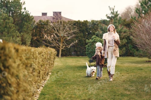 Preview: Mother with daughter walks with a dog