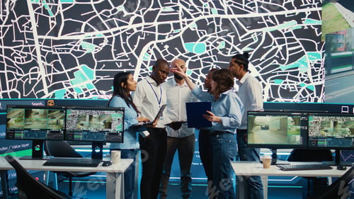 Preview: Diverse team of employees uniting forces to guide delivery trucks