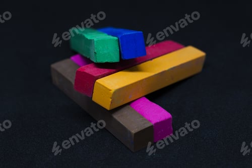Preview: Close-up shot of colorful oil pastels on the black background