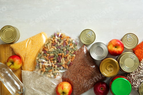 Preview: Many different products and space for text on white wooden background, flat lay. Food donation