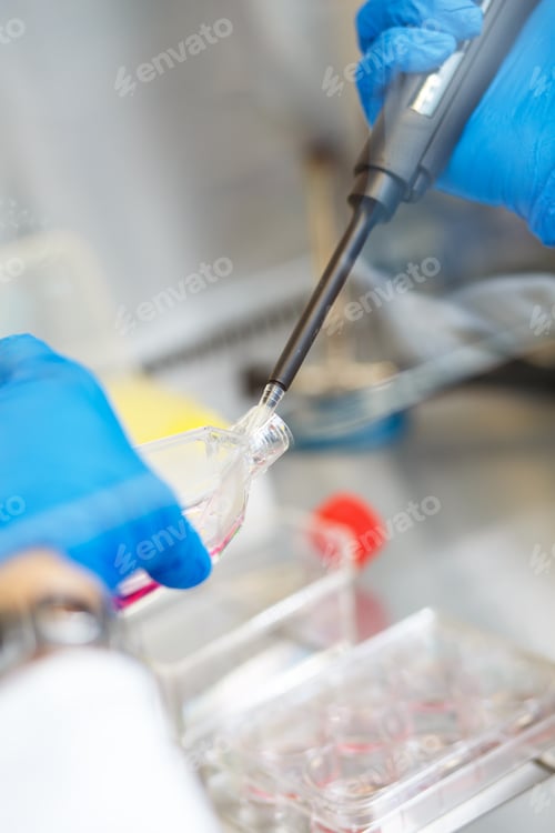 Preview: Close up of scientist hand during scientific experiment in laboratory.