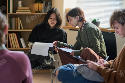 Preview: Diverse Young People Collaborating during Group Therapy Session Indoors