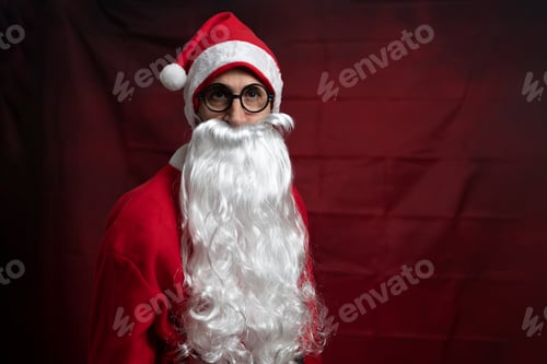 Preview: Portrait of a traditional Santa Claus with a long white beard, wearing a classic red suit