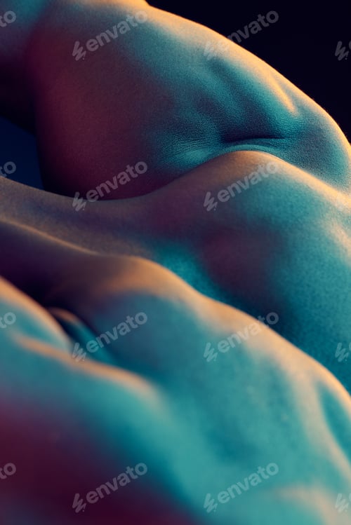 Preview: Is it a body or is it art. Shot of a muscular man posing against a studio background.