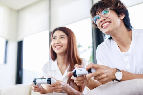 Preview: Fun at Home, Couple Playing Video Games Together on Couch