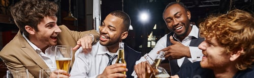 Preview: banner of interracial colleagues in formal wear toasting beer in bar, men having fun after work