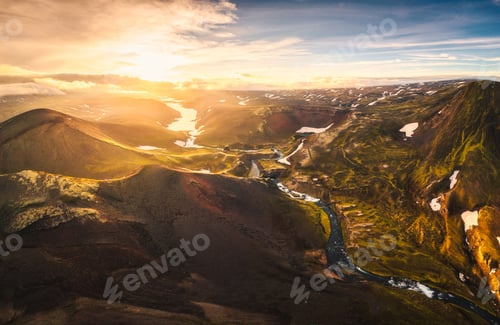 Preview: Sunset over mysterious volcanic crater and glacier stretches through highlands of iceland