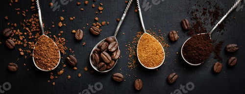 Preview: Coffee in different spoons on dark background