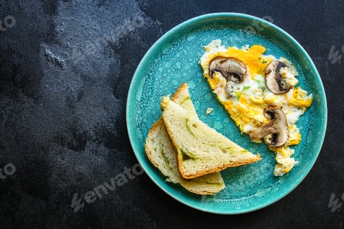 Preview: Scramble Fried Eggs Omelet With Mushrooms Menu Concept Healthy Eating. Food Background Top View