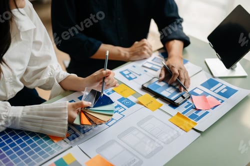 Preview: UX developer and ui designer brainstorming about mobile app interface wireframe design with customer