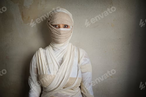 Preview: woman wrapped in bandages