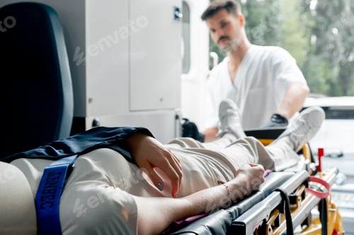 Preview: close up on the street in an ambulance a young patient with an injured neck and arm transporting the