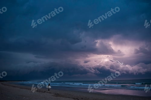 Preview: Mesmerizing view of a surfer on the shore of a sea