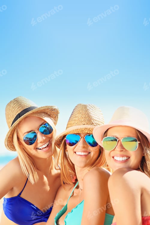 Preview: Group of women having fun on the beach